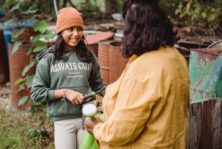 Woman and girl working in garden